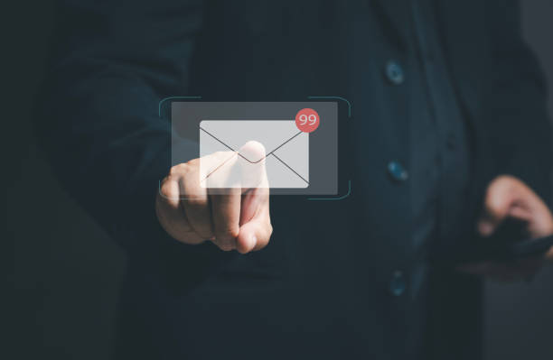 istock email notification concept. Businessman pointing at electronic mail on virtual screen. Marketing through online email marketing. internet technology network for online strategy. Message alert. 1846547455
