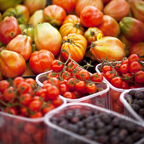 different kind of tomatoes for sale at the farmers market.
