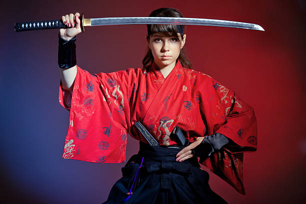 istock Young woman performing kenbu movement with katana 184655231