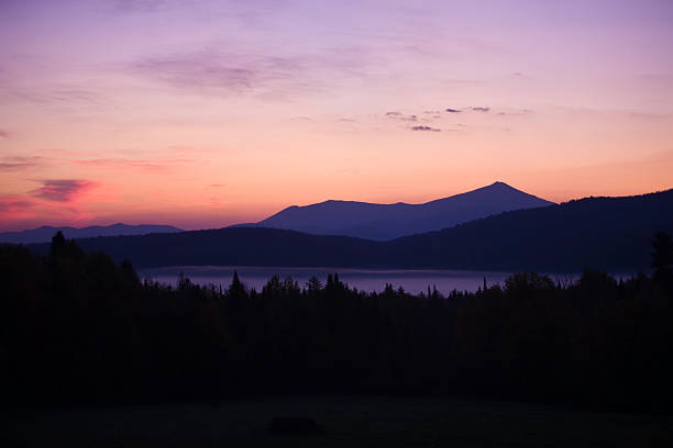 Sunrise over Whiteface Mountain A warm sunrise over Whiteface Mountain in the Adirondacks of upstate New York whiteface mountain stock pictures, royalty-free photos & images