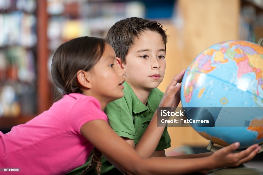 Elementary kids Elementary students in a library classroom Child Stock Photo