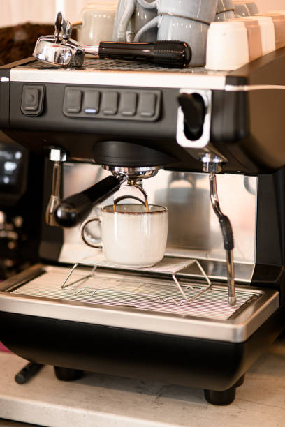 istock Pouring strong coffee in small white cup from professional coffee machine in coffeeshop or cafe 1846577054