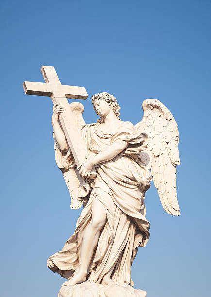 istock Angel Holding a Cross Statue in Rome 184657735