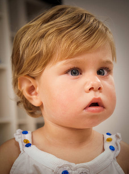 CLOSE UP portrait of adorable little girl with Amblyopia illness.