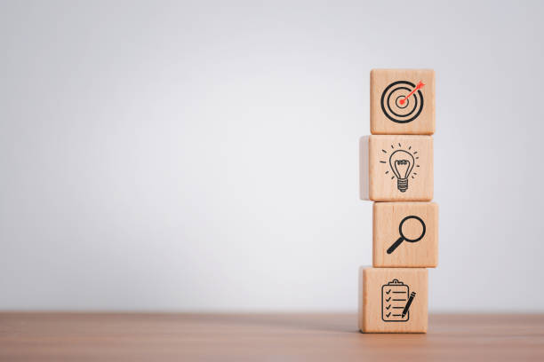 istock Wood cube block stacking with icon. business strategy and action plan Concept. 1846580449