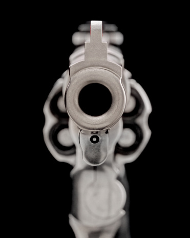 Looking down the barrel of a hand gun