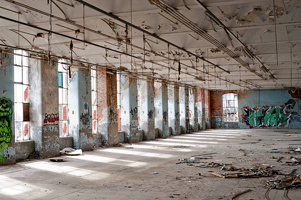 istock Decayed and vandalised interior of derelict factory 184658770