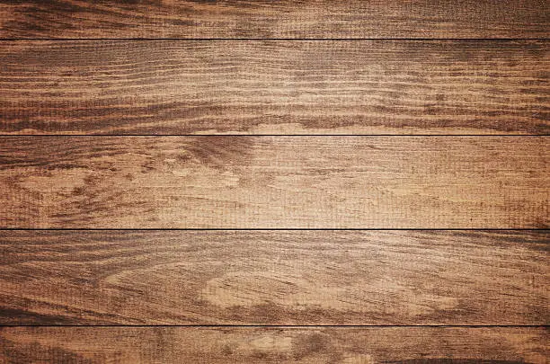 Photo of Overhead view of old dark brown wooden table