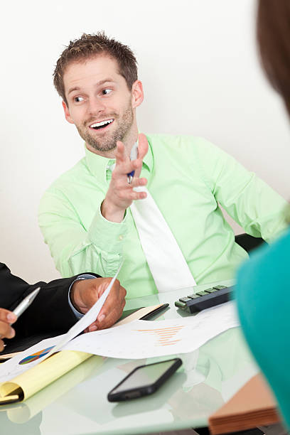 istock Businessman in office meeting with hand up discussing something 184659179