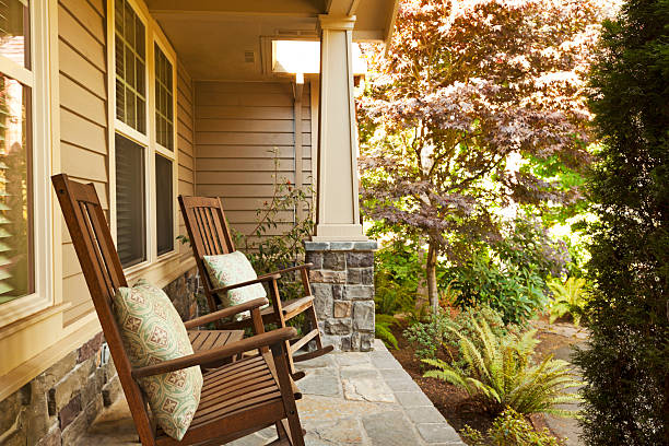 спереди veranda с качание стулья - patio chair стоковые фото и изображения