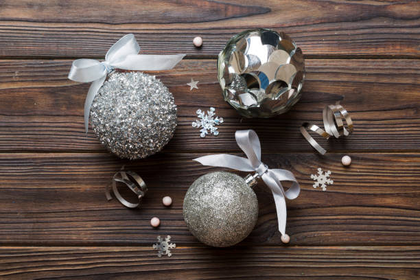 istock Christmas ball on colored background. decoration bauble with ribbon bow with copy space 1846592355