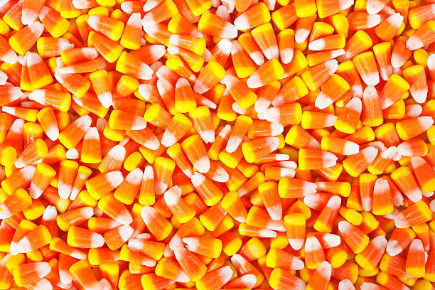 Candy Corn Hundreds Of Traditional Halloween Candy Corn Candies halloween candy stock pictures, royalty-free photos & images