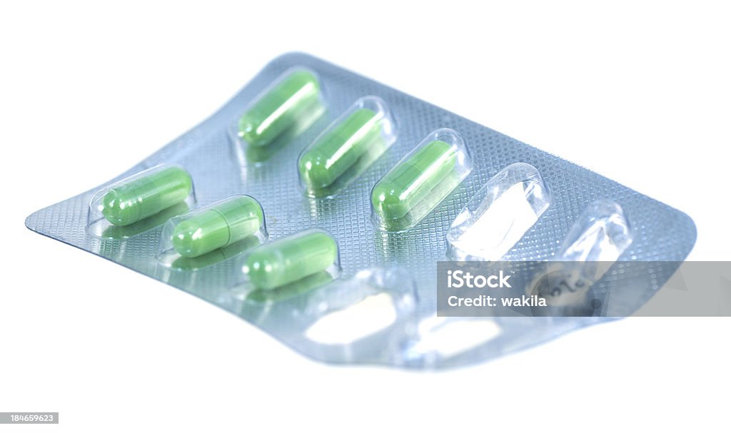 緑色白色の背景に使用される薬 - いっぱいになるのロイヤリティフリーストックフォト
