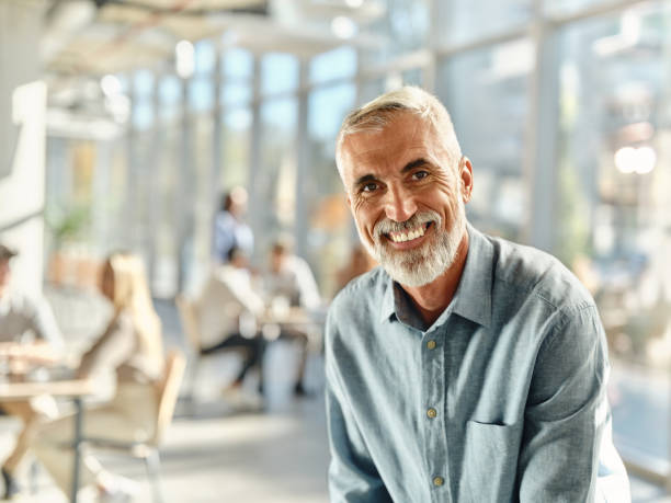 istock Happy senior businessman in the office. 1846596518