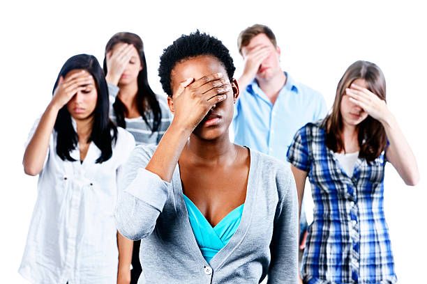 istock Five young people express dismay despair or simply a headache 184659658