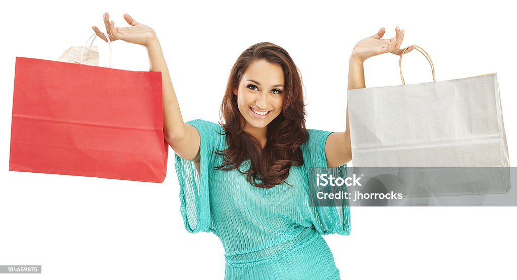 Mujer hispana atractiva joven con bolsas de compras de papel - Foto de stock de Demasiado grande - No queda a la medida libre de derechos