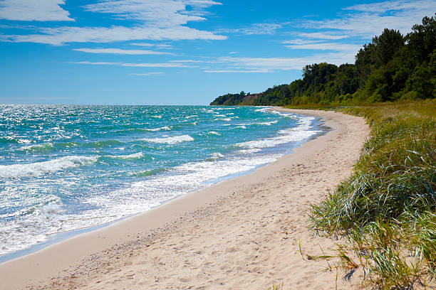 Private Beach With Emerald Waters Private Beach With Emerald Waters lake michigan stock pictures, royalty-free photos & images