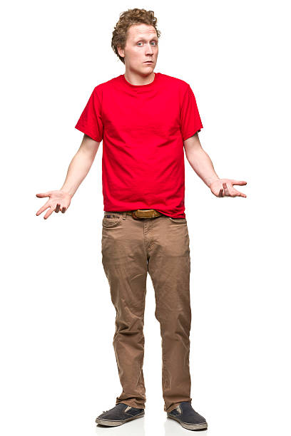Shrugging Young Man Portrait of a young man on a white background. http://s3.amazonaws.com/drbimages/m/jm.jpg arms outstretched stock pictures, royalty-free photos & images