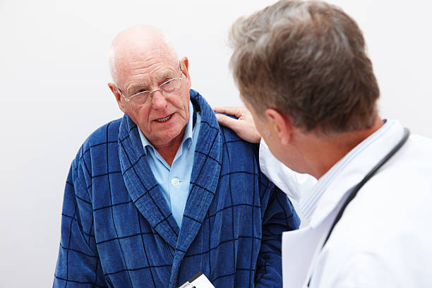 istock Senior Man Talking With His Doctor 184660676