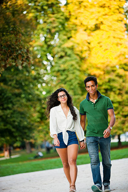istock Happy Young Couple Walking in Park 184660785