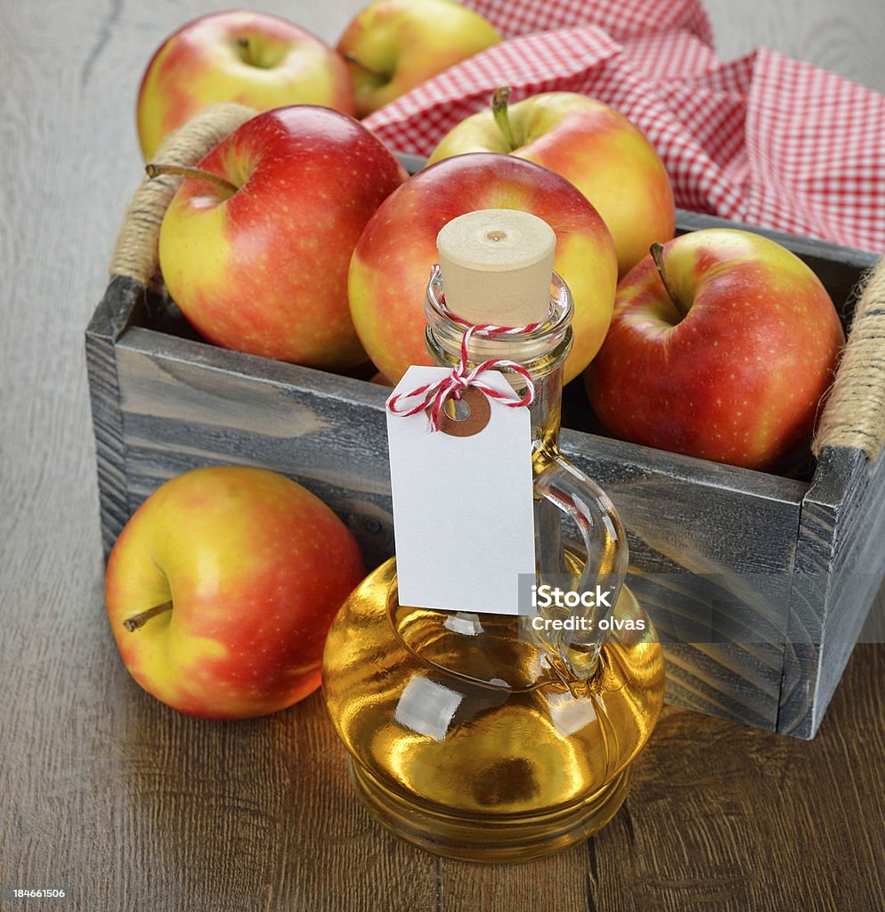 apple cider vinegar apple cider vinegar on a brown table Apple - Fruit Stock Photo