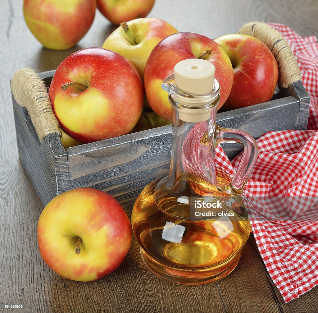 apple cider vinegar apple cider vinegar on a brown table Apple - Fruit Stock Photo