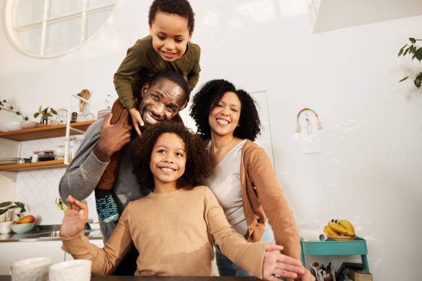 istock Happy black family having fun in the kitchen. 1846618286