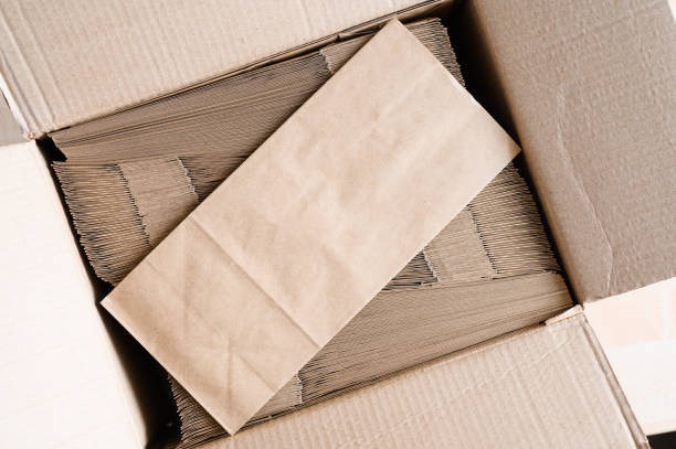 istock Box with new paper bags. Packaging made from biodegradable materials. zero waste concept. Free space for logo 1846642225