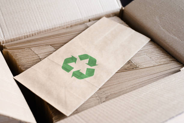 istock Packaging made from biodegradable materials. Paper bag with a recycling sign. zero waste concept. 1846642226