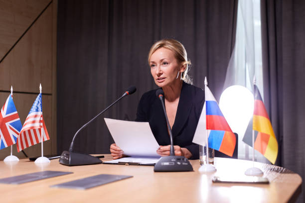 istock beautiful caucasian female delegate in formalwear looking at audience 1846651185