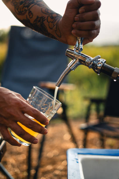 istock Beer on the table and camping party,hands toasting in beer, 1846662455