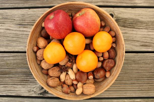 Tangerines, apples and nuts during St. Nicholas season