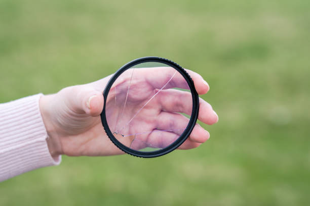 istock Cracked protective glass. Broken photo-filter of camera 1846678377