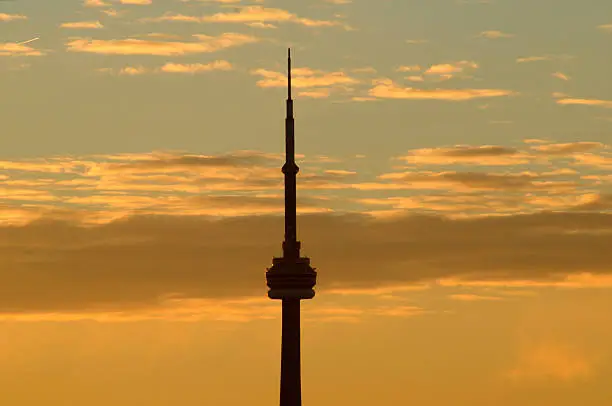 sunrise in toronto with view of cntower silhouette