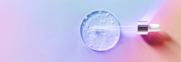istock pipette drops of serum on pink background 1846685186