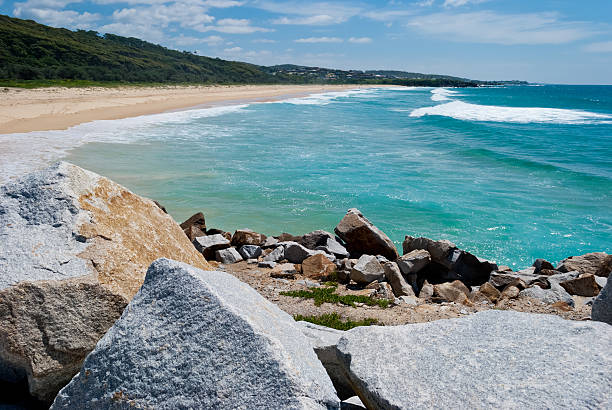 istock Sunny beach with rocks and crisp water 184669404