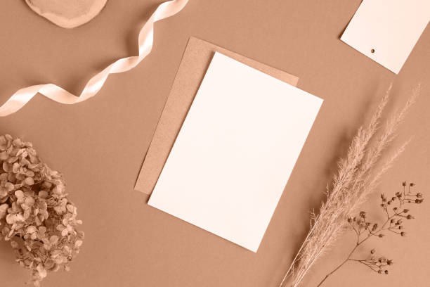 istock Blank greeting card, invitation mockup. Dry grass, pampas plant on beige table background. Flat lay, top view. Copyspace. Paper cards, mock up. Modern Minimal business brand template. Soft shadow, A6 1846705256