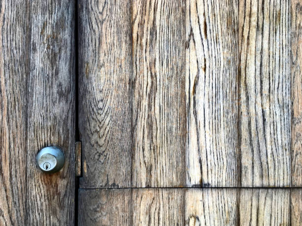 istock front facing beautiful aged texture plank wood door with stainless steel mortise lock 1846708391