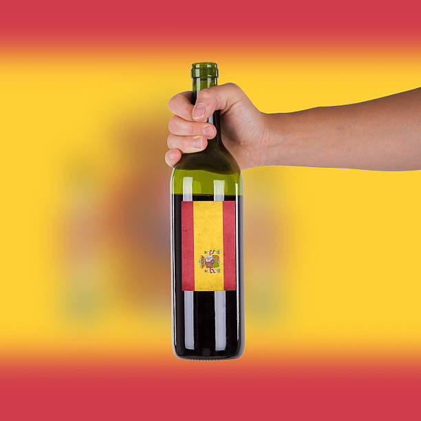 istock Hand holding a bottle of red wine 184671140