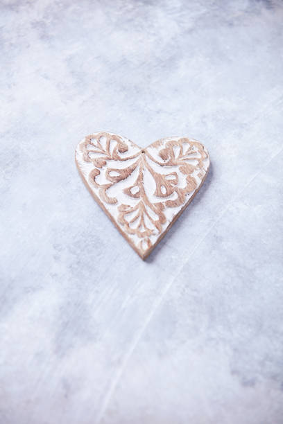 Wooden Heart (Christmas ornament) on bright background. Soft focus. Copy space.