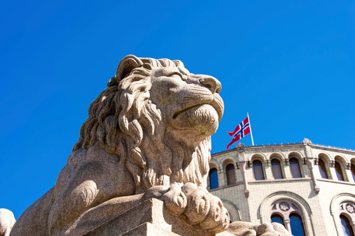 Lion statue near Norwegian parliament Storting Oslo, Norway