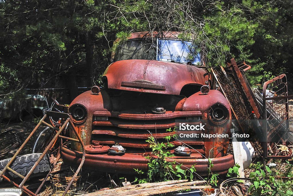 Beat Up Old Truck Old truck surrounded by trash on a farm in Kentucky Farm Stock Photo