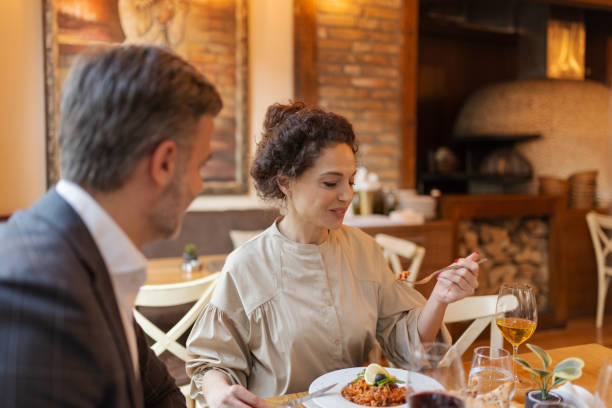 istock Loving Couple Enjoying Lunch in Restaurant 1846745226