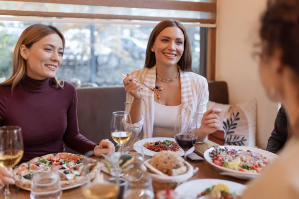 istock Happy Friends Having Lunch in the Restaurant 1846749517