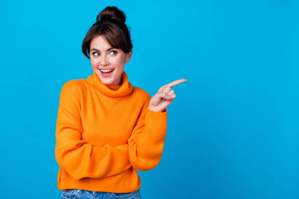 istock Photo of excited funky lady wear knitted pullover looking showing finger empty space isolated blue color background 1846758521