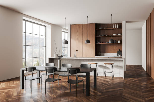istock Stylish home kitchen interior with dining table, bar counter and window 1846770726