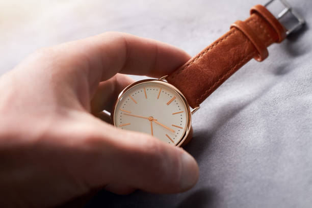 istock A leather watch in the hands of a man 1846773417