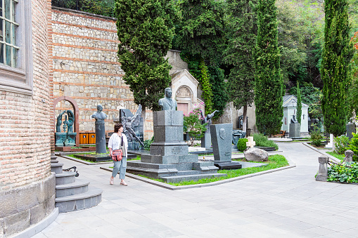 Tbilisi, Georgia - September 25, 2023: graveyard at Mtatsminda Pantheon of Writers and Public Figures in Tbilisi city on autumn day