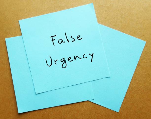 istock Office notepad on envelope written False Urgency - exaggerated artificially, often to pressure employees into taking immediate action such as  exaggerated deadlines or setting unreasonably short deadlines without valid reasons 1846775075