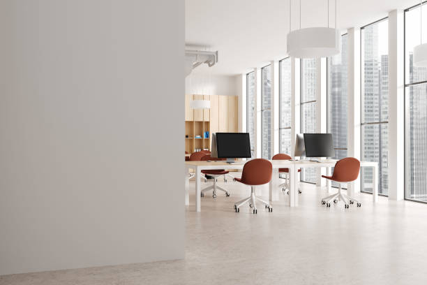 istock White and wooden open space office corner with blank wall 1846787743